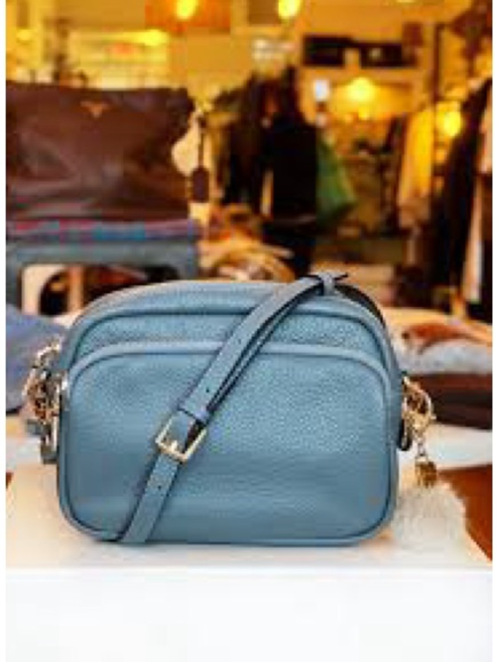 The Pom Pom London blue City Leather crossbody purse